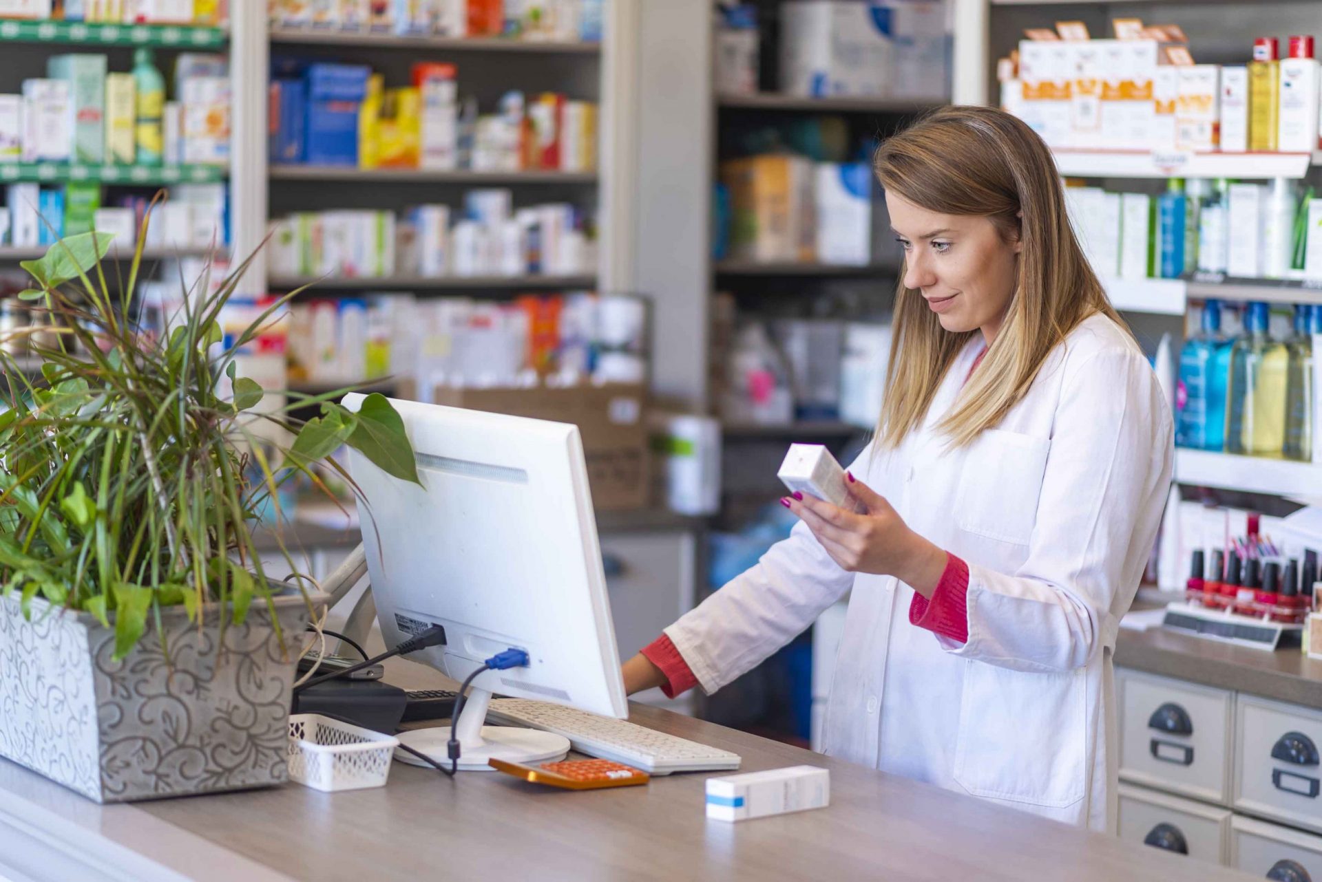 Pharmacist_Behind_Counter-scaled